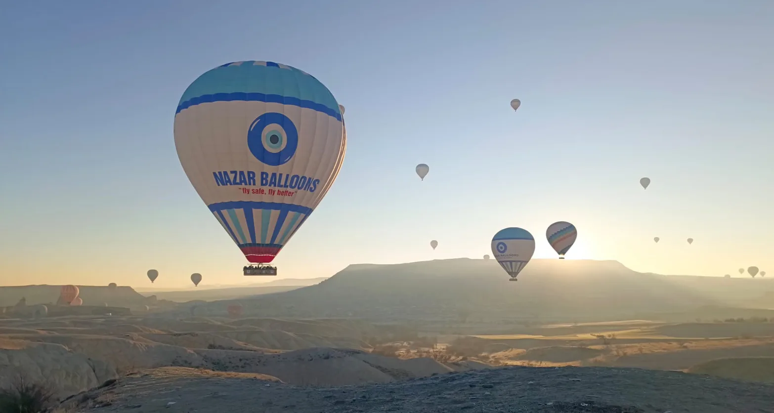 Nazar Balloons floating over the sunrise skies in Cappadocia